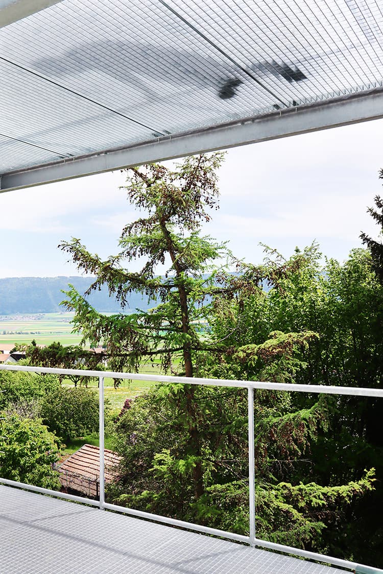 Sunset is the addition of winter gardens on a village house in Cernier, Switzerland